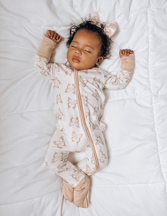 baby girl in milkykntosco romper