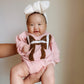 Pink football bubble romper