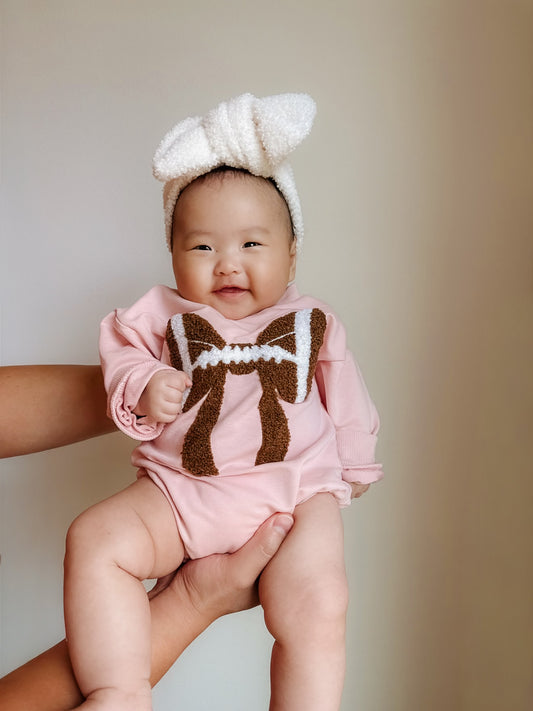 Pink football bubble romper