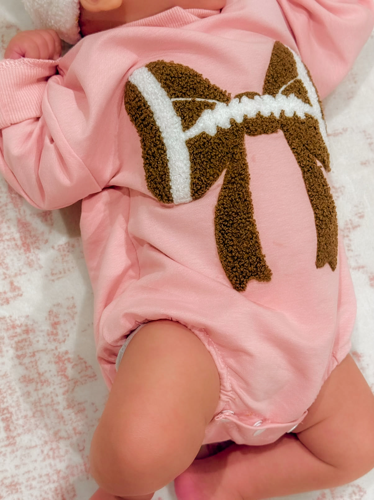 Pink football bubble romper